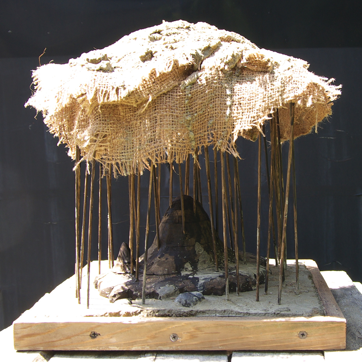 Atmosphere (The Thing I Can't Name), 2026, Mixed Media (Wood, Cement, and Sackcloth), ~12 by 12 by 12 Inches.